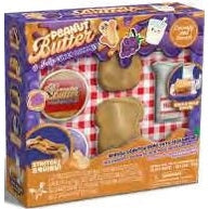Here is a descriptive alt tag for the image:
Boxed "Peanut Butter" squishy toy set with bread, peanut butter, grapes, and milk accessories on a red and white checkered backdrop.